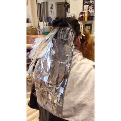 hair processing in foils during color correction appointment