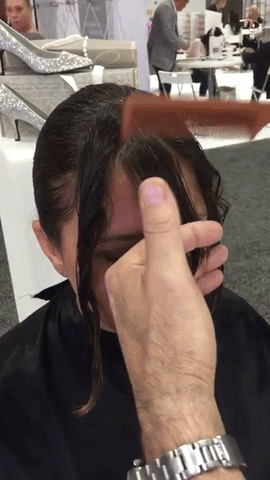 cutting bangs with a razor and combing hair
