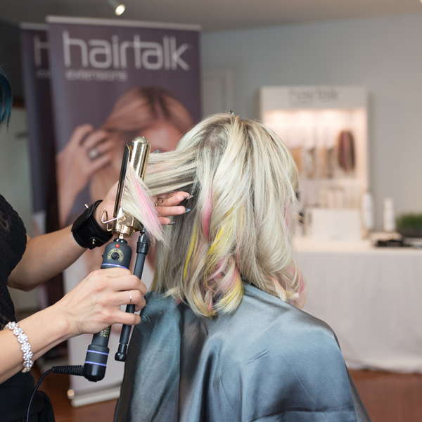Curling extensions from hairtalk extensions using pops of color and a Hot Tools Marcel Iron step by step photos