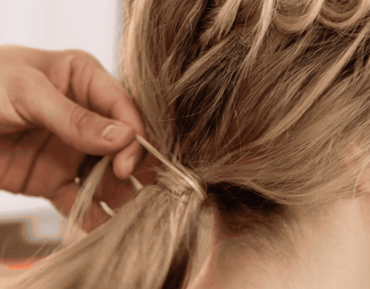 Watch + Create This Cool Elevated 3-Strand Braid + Low Ponytail
