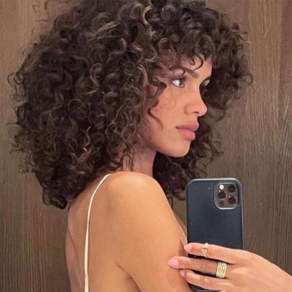 winter 2021 haircut trends curly midlength textured layers curly bangs