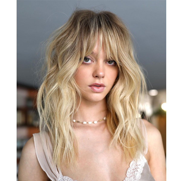 winter 2021 haircut trends face framing shaggy layers barely there bangs