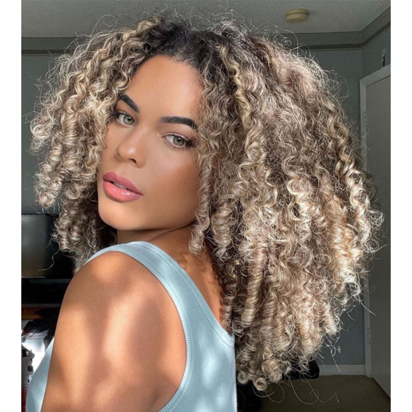 winter 2021 hair color trends muted beige sandy blonde curly hair