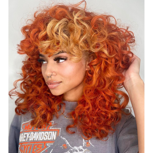 hair color 2022 trend forecast warm red orange hair peekaboo money piece