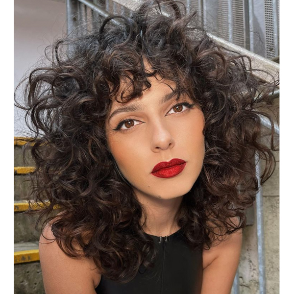 2022 haircut trends spring summer curly midlength shag