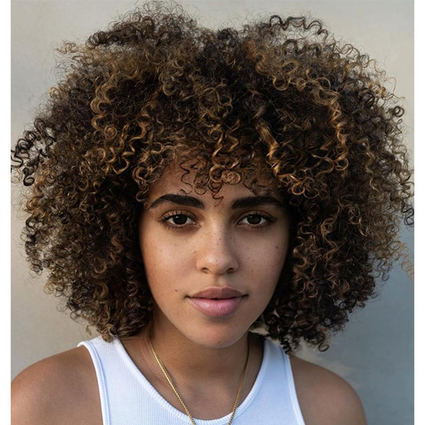 fall haircut trends 2022 midlength curly cut with bangs