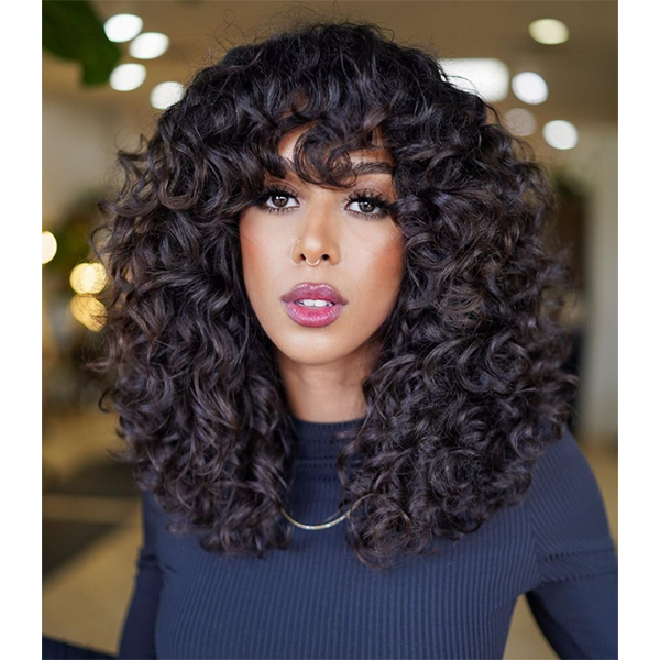 THE BIGGEST HAIRCUT TRENDS OF FALL AND WINTER 2023 CURLY SHAG FRINGE