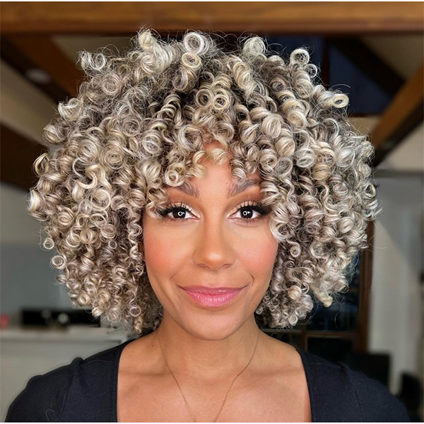 THE BIGGEST HAIRCUT TRENDS OF FALL AND WINTER 2023 SHORT CURLY CUT WITH FRINGE