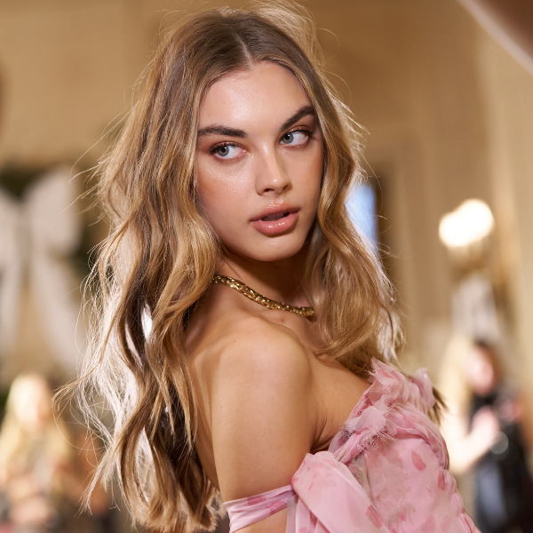 Blonde model with soft, voluminous waves at LoveShackFancy NYFW 2025.