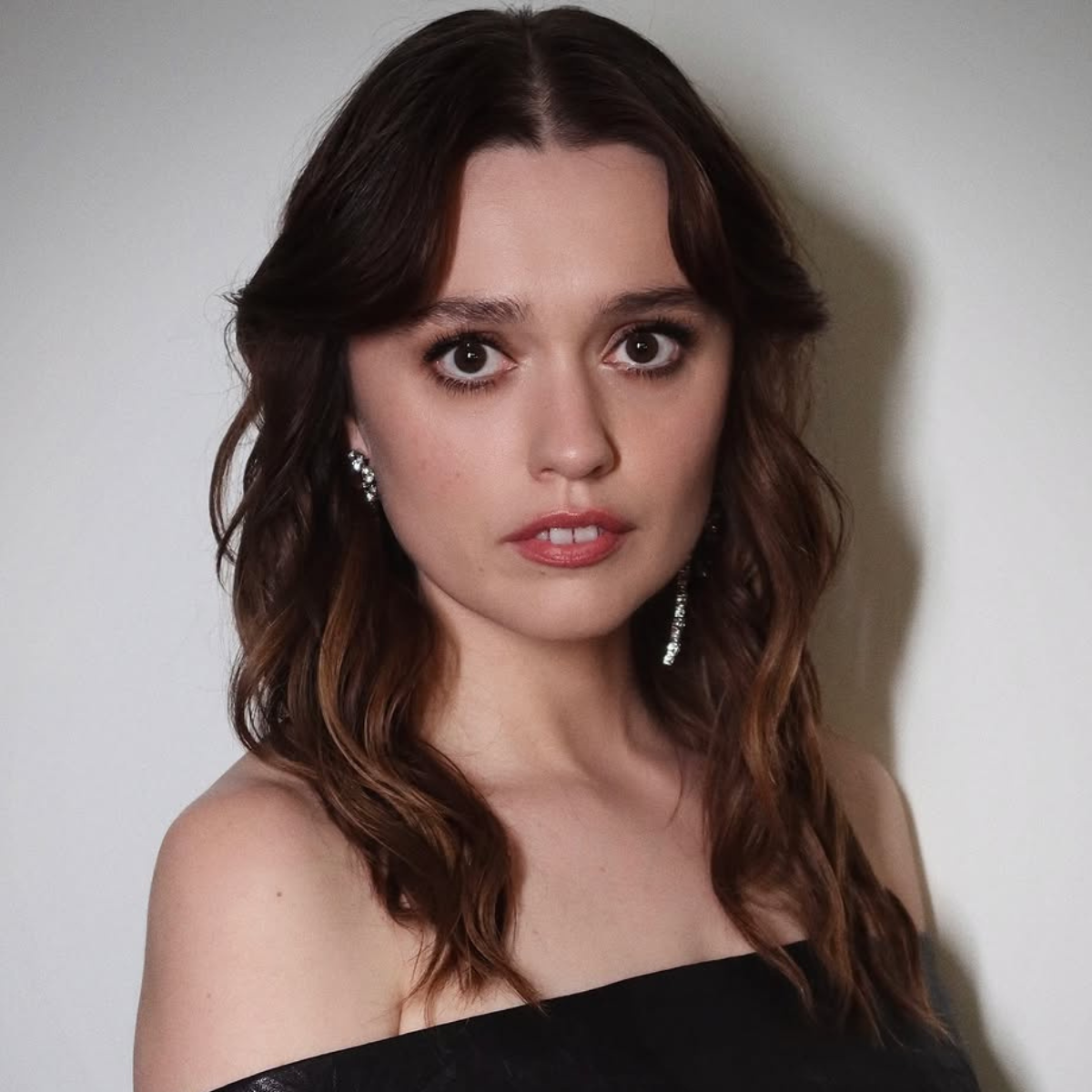 Aimee Lou Wood's glossy brunette transformation with soft, lived-in depth and subtle tonal blends