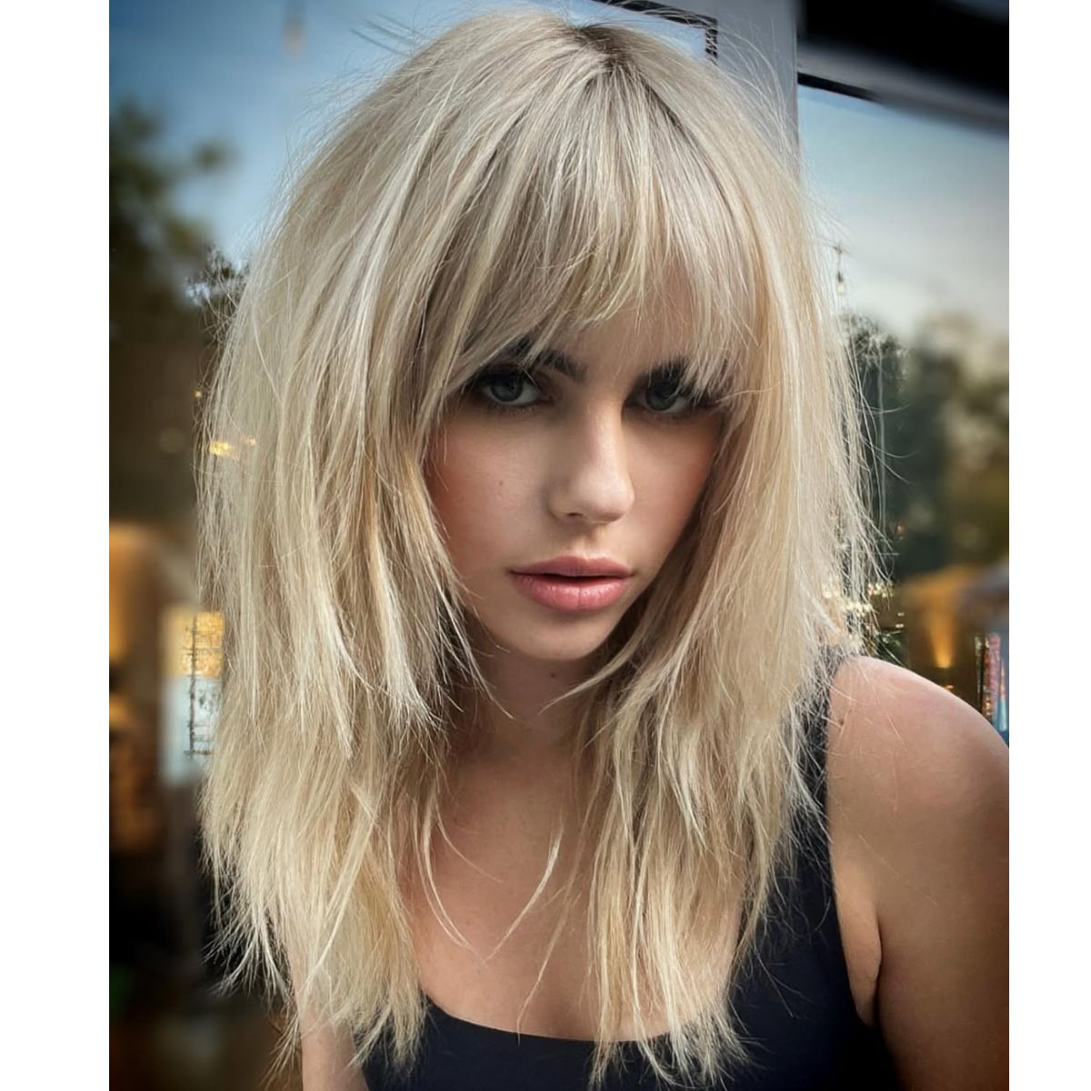 A blonde shag with bangs