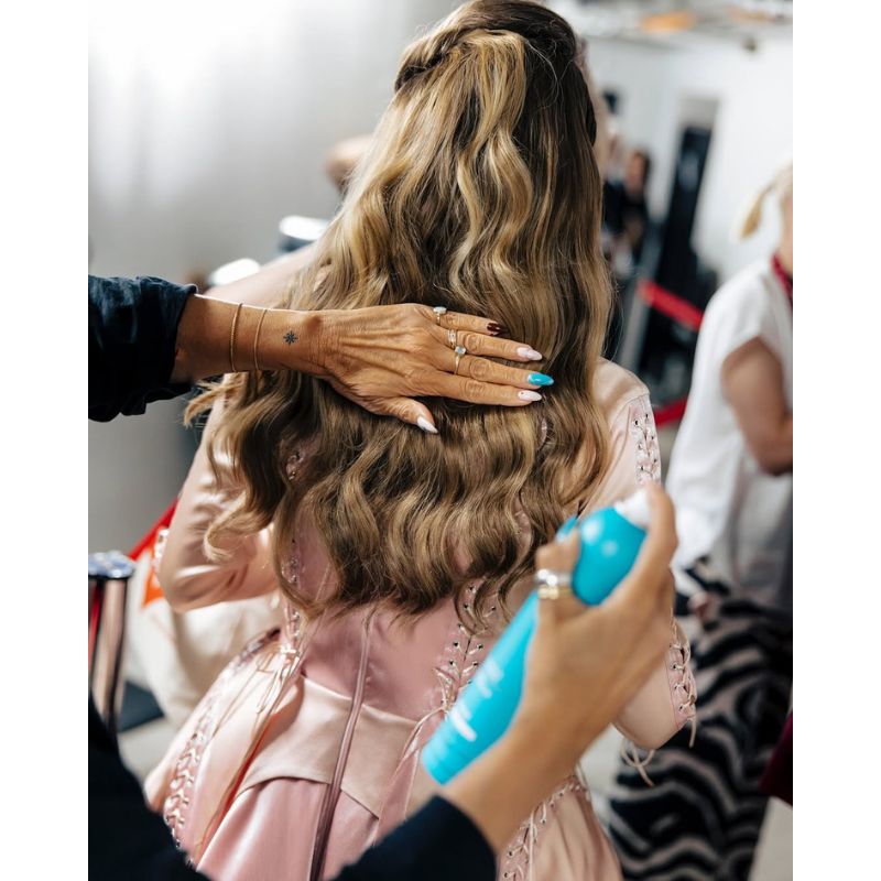 Eurovision 2025 Moroccanoil backstage woman spraying hairspray