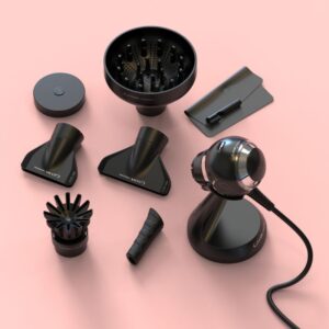 A flat lay view of the GA.MA Professional iQSFERA spherical hair dryer with its full accessory set, including multiple nozzles, diffuser attachments, a handle grip, cleaning tools and the Smart Holder stand, displayed on a pink background.