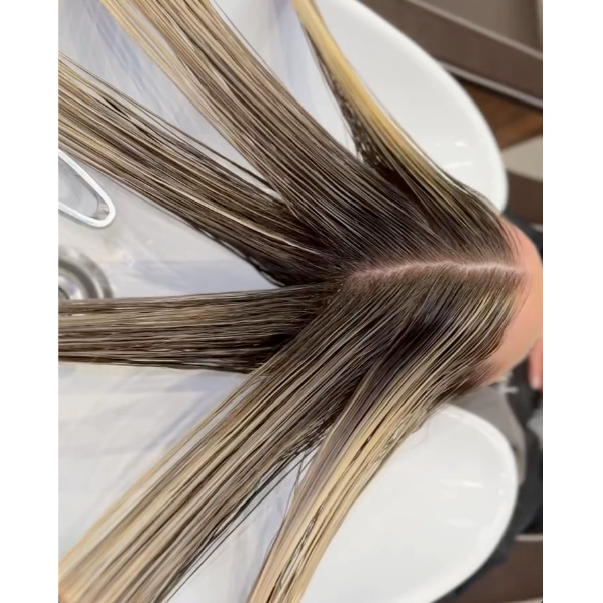 pearl blonde hair toning at shampoo bowl