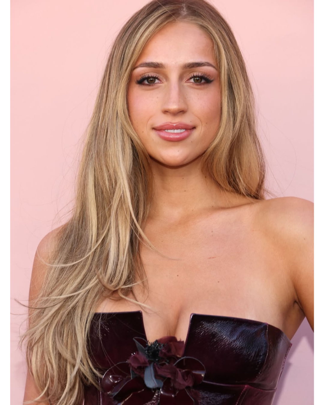 Tate McRae with dimensional blonde hair color and a glossy, expensive-looking finish